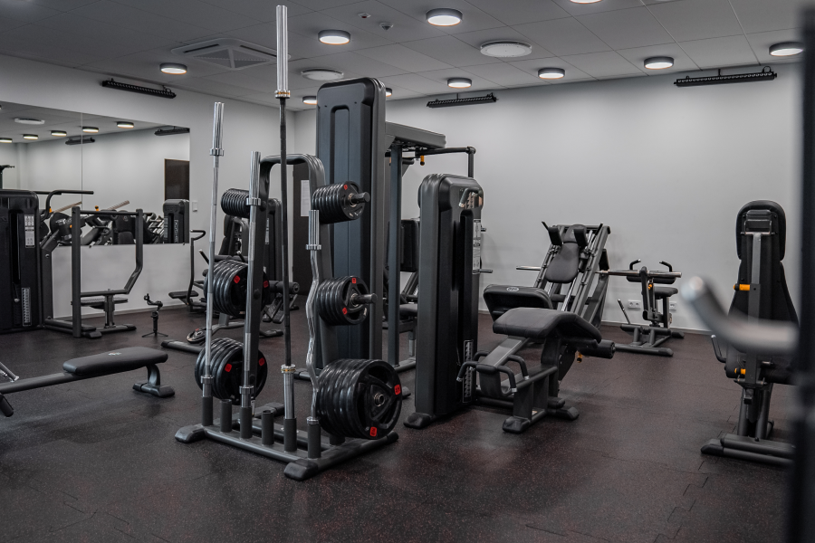 Commercial gym equipment arranged for routine preventative maintenance and service scheduling